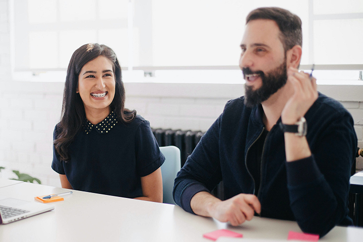 Colleagues sitting at a desk