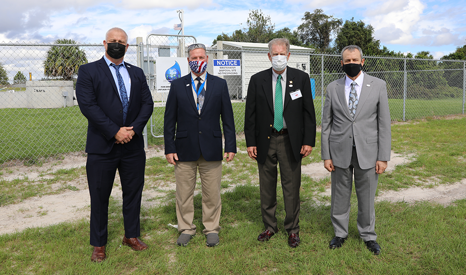 Sparton and County leadership stand in front of new wastewater treatment plant
