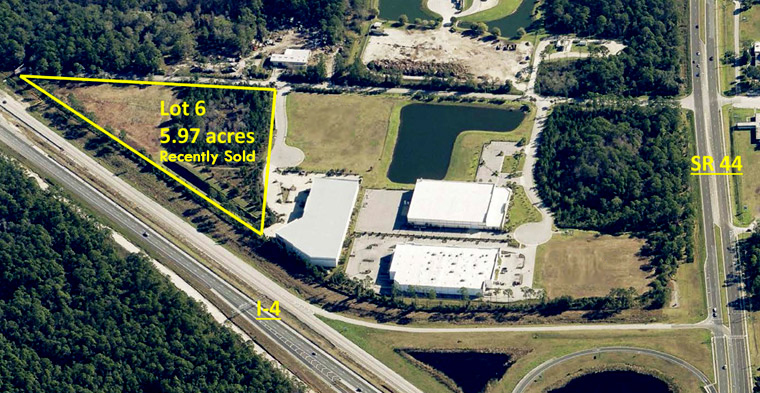 Aerial photo of Deland Crossings properties showing a polygon border to indicate the 5.97 acres on Lot 6 that was recently sold.